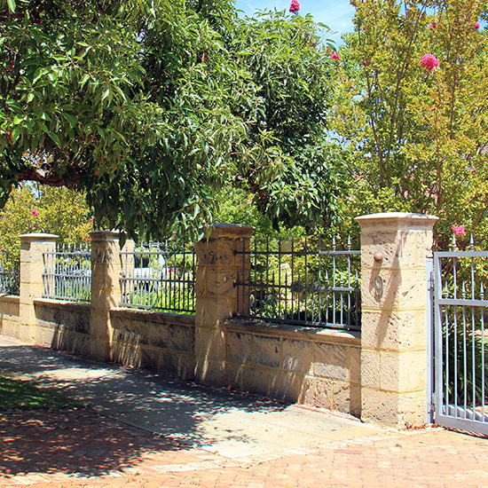 Aged Natural Limestone with Sandstone Pier and wall Capping